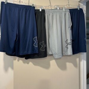 4 pairs of men’s large under armour loose heat gear workout shorts